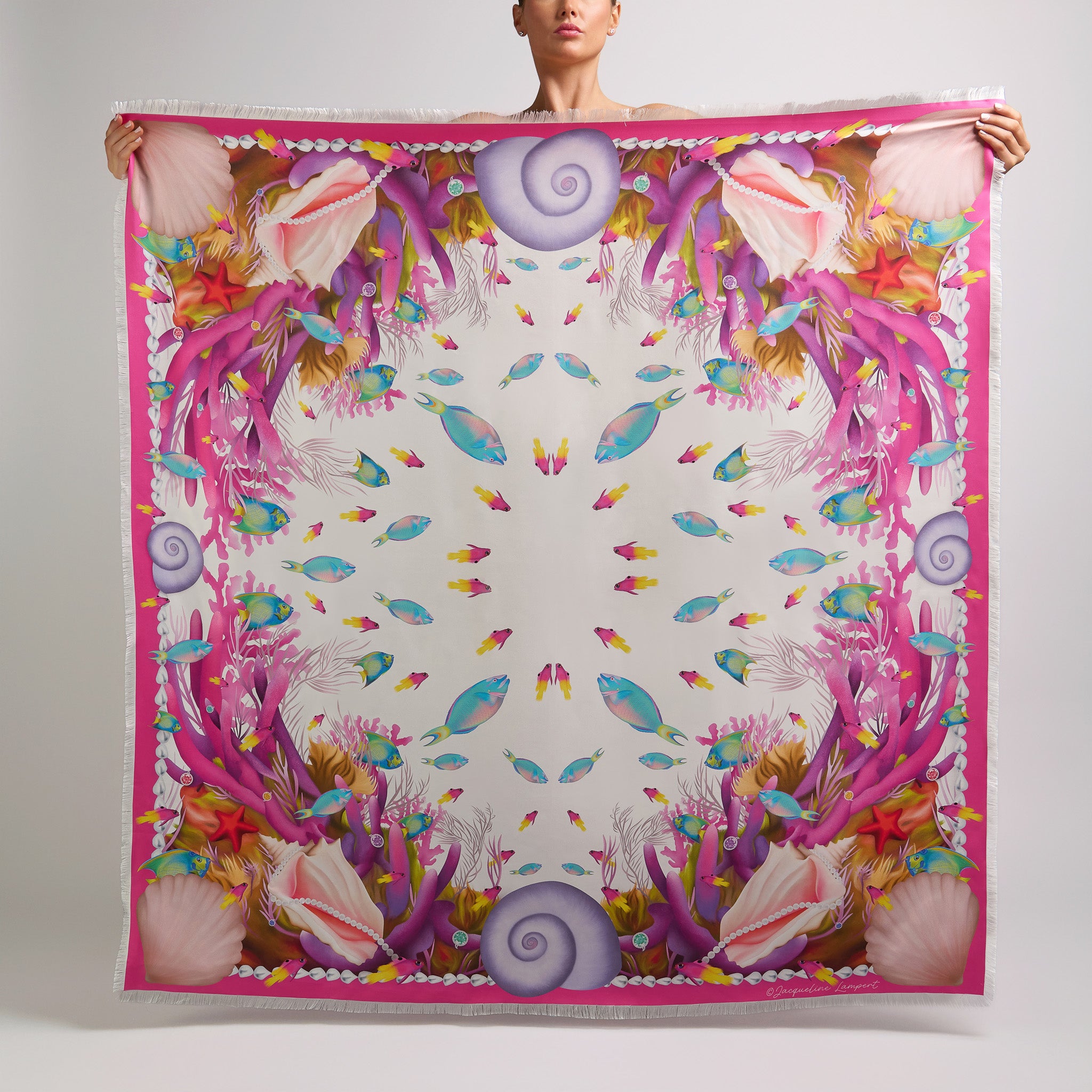 White Caribbean silk grande scarf featuring colorful tropical fish, pink coral, seashells, and pearl border details.