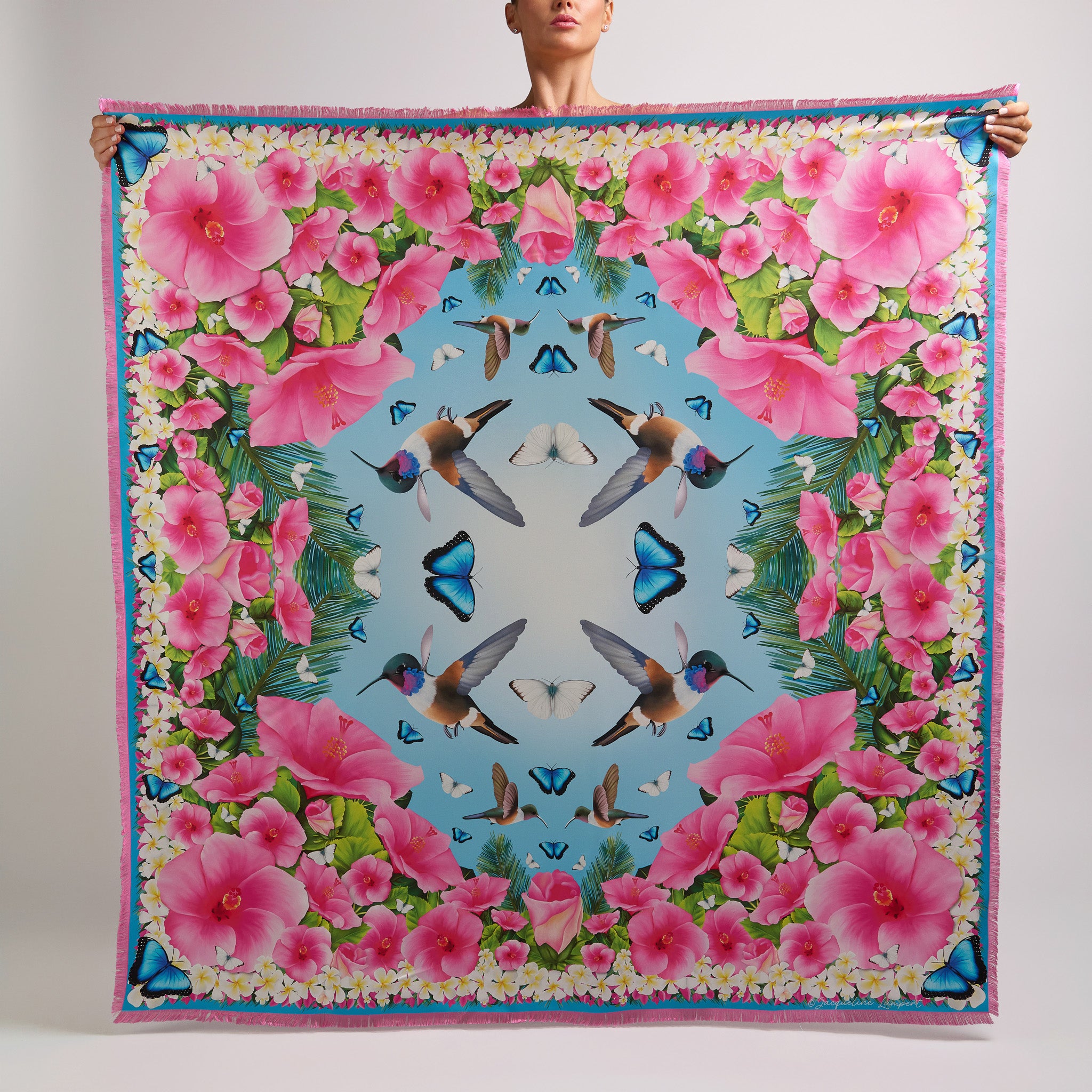 Sky blue grande silk scarf featuring hand-drawn Bahama Woodstar hummingbirds, hibiscus flowers, blue morpho butterflies, palm leaves, and frangipani inspired by the Caribbean