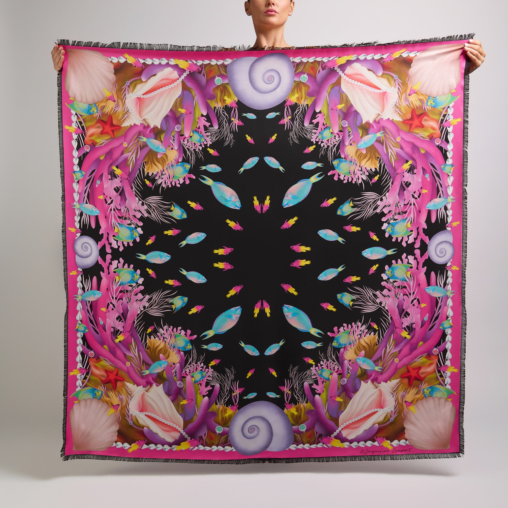 Black Marine Treasures silk grande scarf featuring hand-drawn Caribbean fish, pink coral, conch shells, pearls, and tropical marine life.